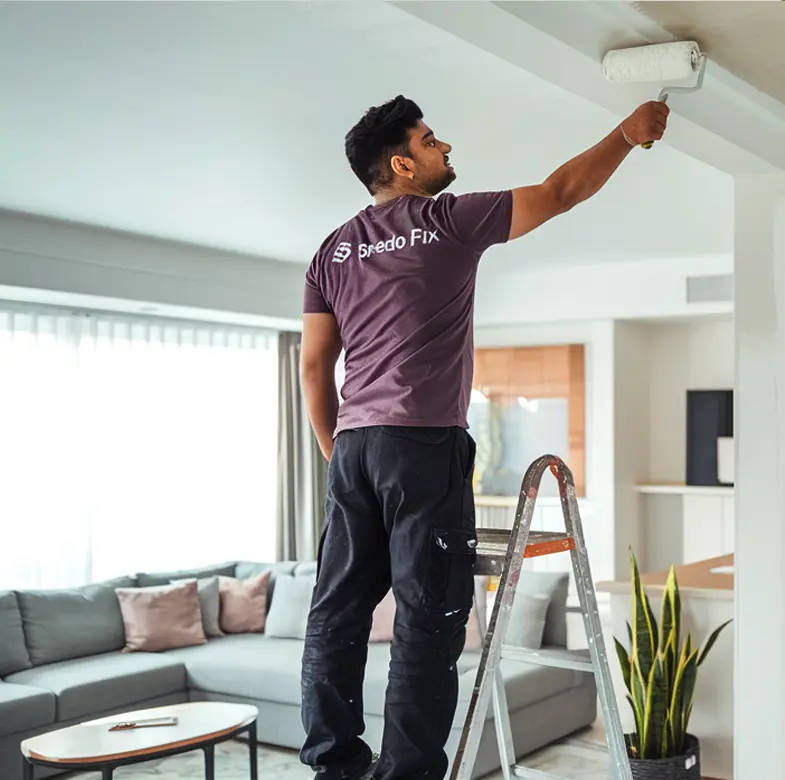 SpeedoFix painter painting the ceiling of an apartment at Palm Jumeirah, Dubai.